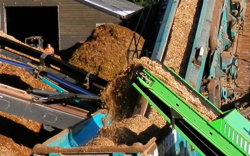 Electric loader screening our wood chip